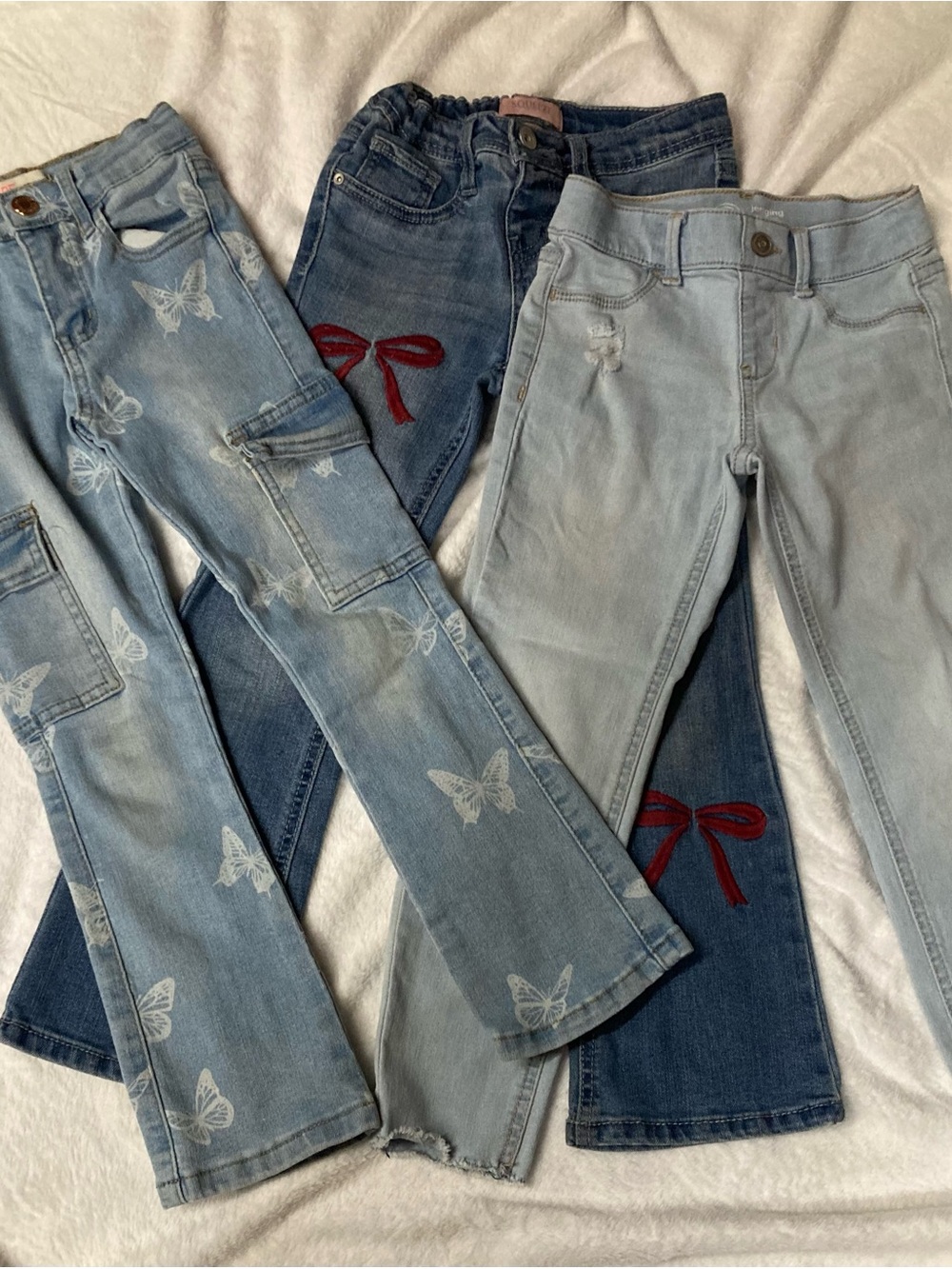 Three pairs of Girls Light Blue and Dark Blue Embroidered Jeans